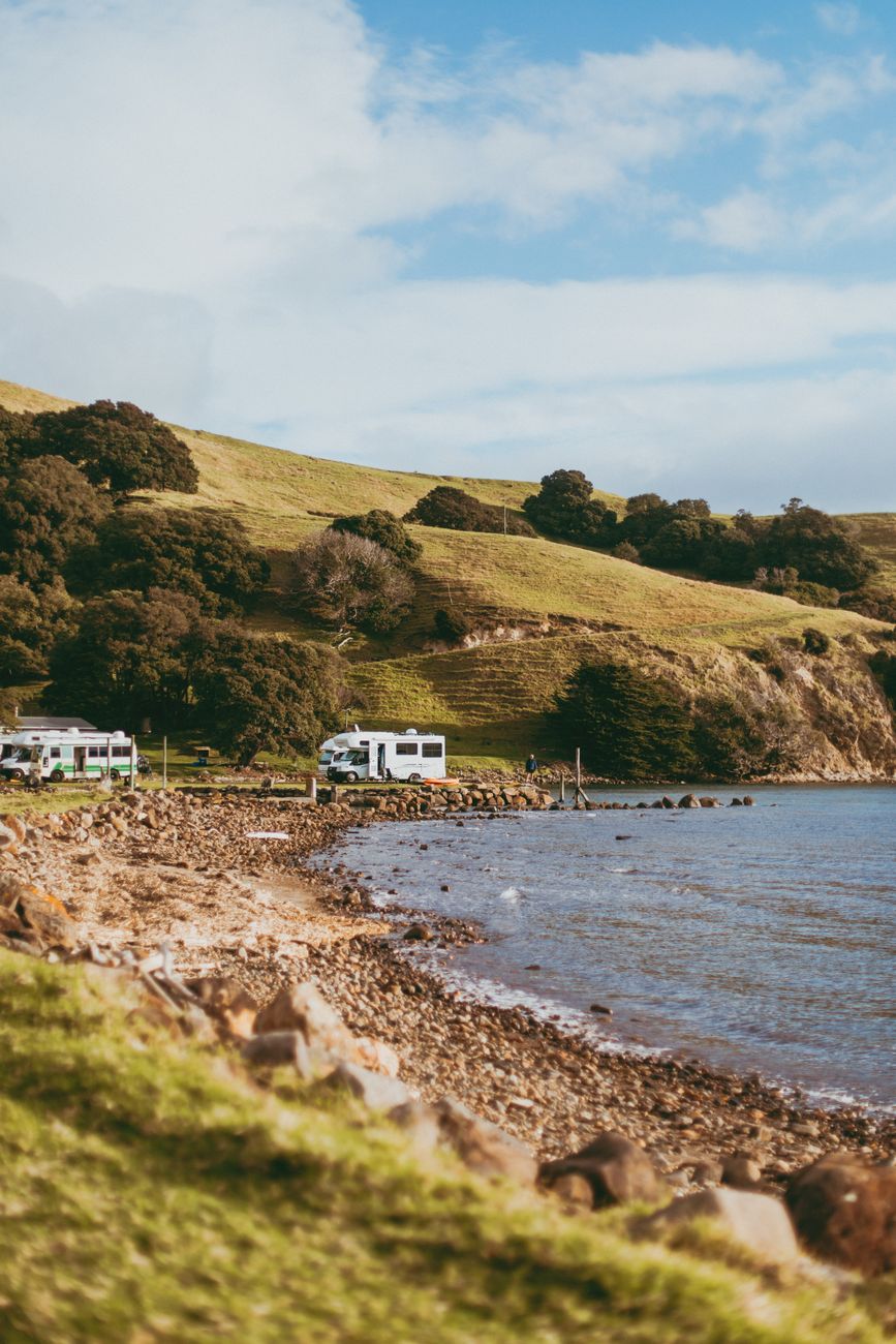 Campervan parked along scenic coastal New Zealand road
