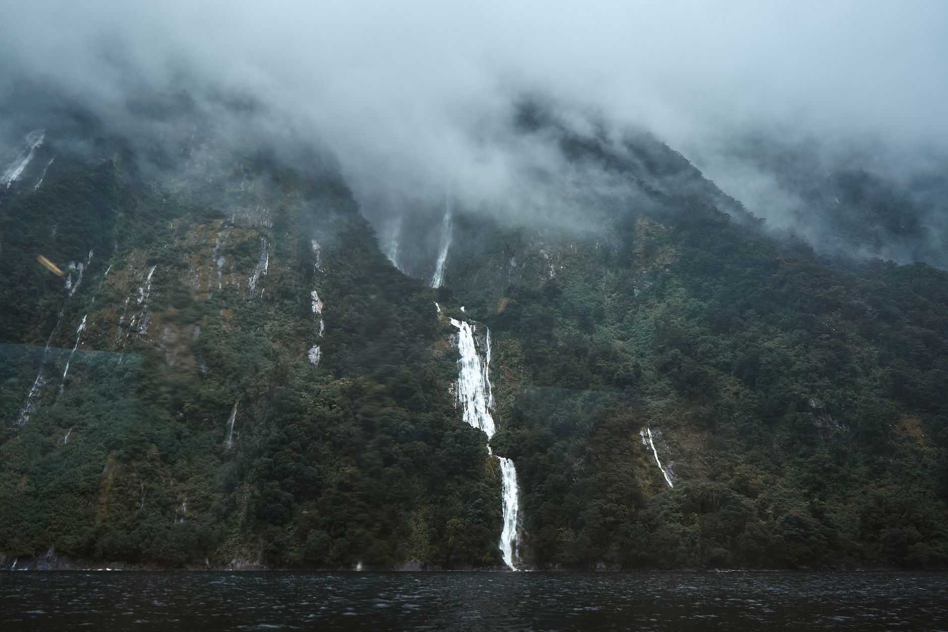 Fiordland misty mountain waterfalls New Zealand